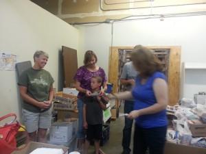 Beth hands out checks personally